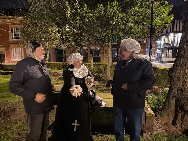 In character, churchyard by night